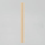 Five light wooden chopsticks are arranged vertically on a plain, light gray background. The chopsticks are evenly spaced and aligned in a straight row.