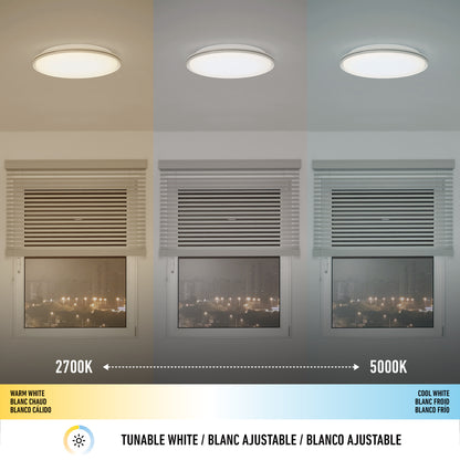 The Artika Astrid 16.5 in. LED flush mount light offers five color temperatures, shown above a window with warm (2700K, left), neutral (middle), and cool (5000K, right) white settings that each change the rooms color tone. Remote control included.