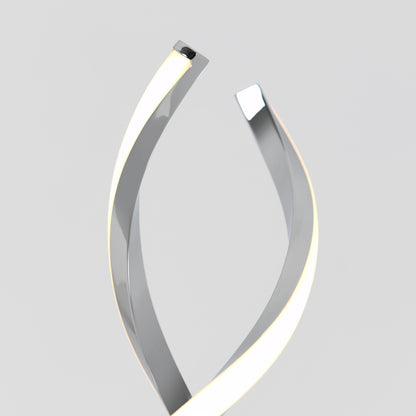The Artika Swirl LED table lamp features two metallic, curved strips with glowing edges that twist upward against a light gray background, forming an abstract, modern, and minimalistic design.