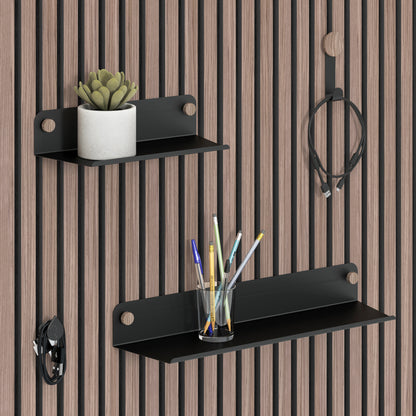 The Artika Sonokit set of shelves and hooks for Sonolok and Sonofold wall panels holds a potted succulent, pens, charging cable, and headphones. Enjoy quick installation and an organized workspace with this versatile storage solution.
