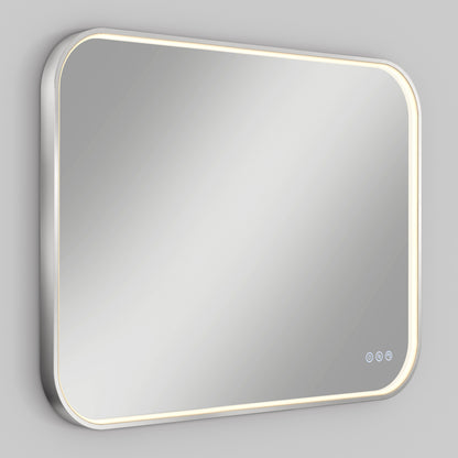A rectangular wall-mounted mirror with rounded corners, featuring a built-in LED light strip around the edge and three touch control buttons in the lower right corner, displayed against a gray background.