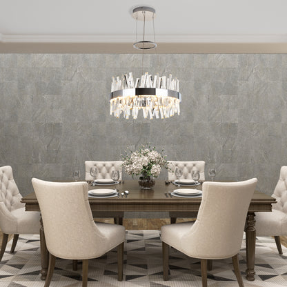 Elegant dining room with a wooden table for six, beige upholstered chairs, Artikas Enchanted LED pendant light as the centerpiece, neutral textured wallpaper, and a floral arrangement on the table.