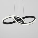 A modern pendant light with two large, interlocking black rings, one lined with bright LED lights, suspended by thin black cables against a plain light gray background.