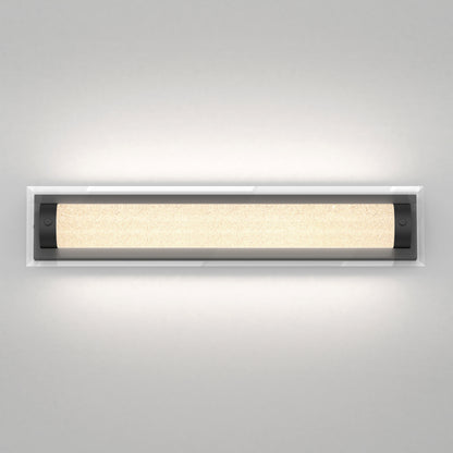 The Artika Glamour LED bathroom vanity light 3 CCT features a modern rectangular design with frosted center and black end caps, mounted on a light gray wall for soft, even illumination.