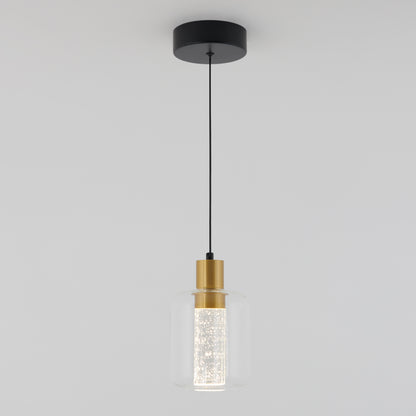 The Artika Champagne Globe modern LED pendant light features a black ceiling mount, black cord, gold accent, and a clear cylindrical glass shade with a textured interior, shown here against a plain white background.