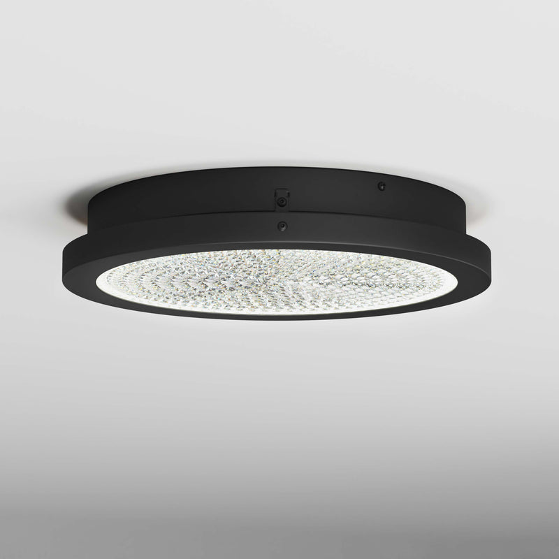 Artika Glitter 14 in. LED flush mount ceiling light, round black design with a textured, illuminated surface on a white ceiling.