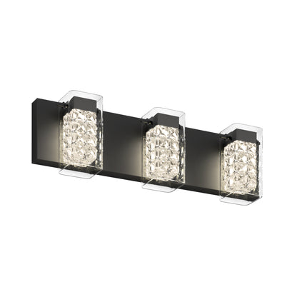 The Artika Crystal Cube LED bathroom vanity light features three rectangular lights with black bases and clear, textured glass covers, arranged horizontally for a modern wall-mounted design.