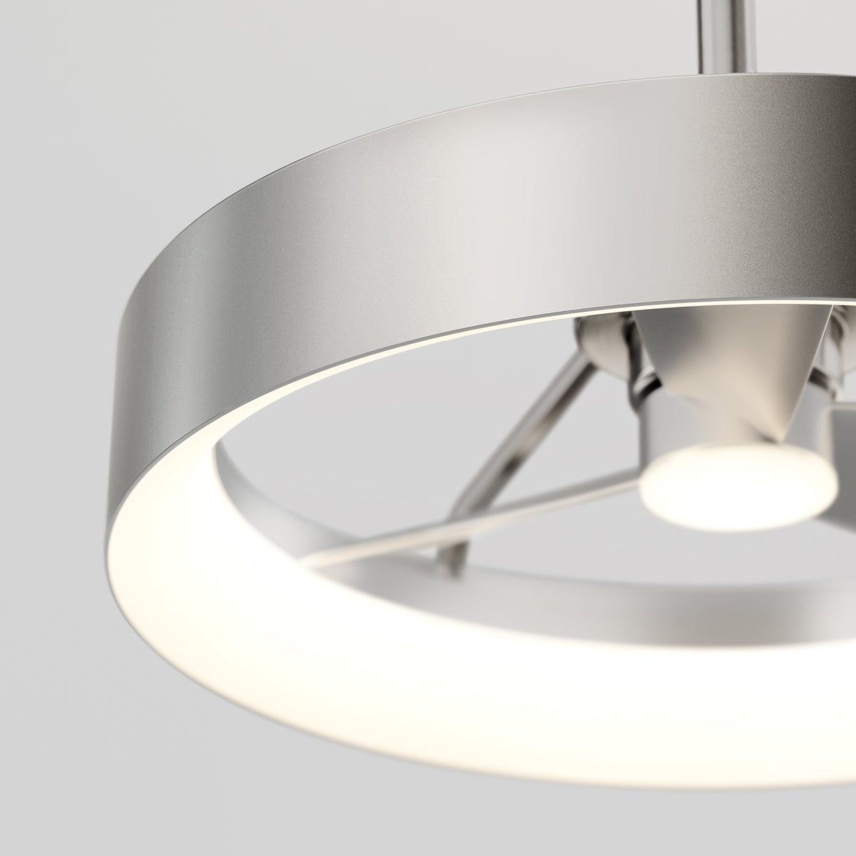 Close-up of the Artika Austin 23 in. LED modern ceiling fan, featuring a sleek, circular metallic design with a glowing white LED ring and remote control, set against a plain light background.