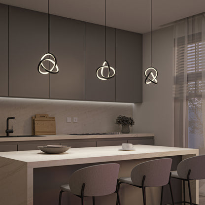 Modern kitchen with a marble island, three gray bar stools, minimalist cabinetry, and three Artika Zephyr LED pendants hanging above the island. Soft lighting and a large window with sheer curtains complete the space.