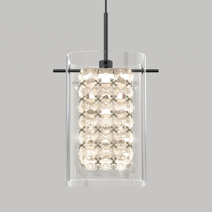The Artika Crystal Cube 1-light LED pendant features a clear cylindrical glass shade and inner faceted crystals suspended from a black rod, shown against a plain gray background.