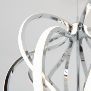 Close-up of the Artika Meridian LED pendant light featuring intertwined curved chrome design and white light strips, set against a plain light gray background—an elegant piece of contemporary lighting.