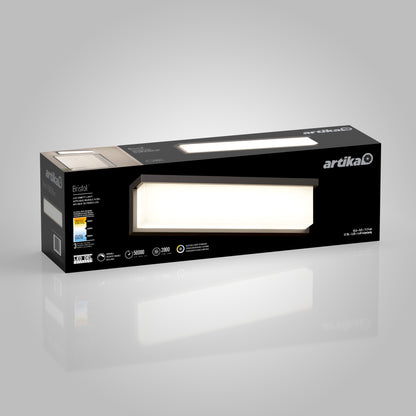 A rectangular black box displays the Artika brand and an image of the Bristol modern LED bathroom vanity light 3 CCT, highlighting energy efficiency, brightness, and a sleek contemporary design.
