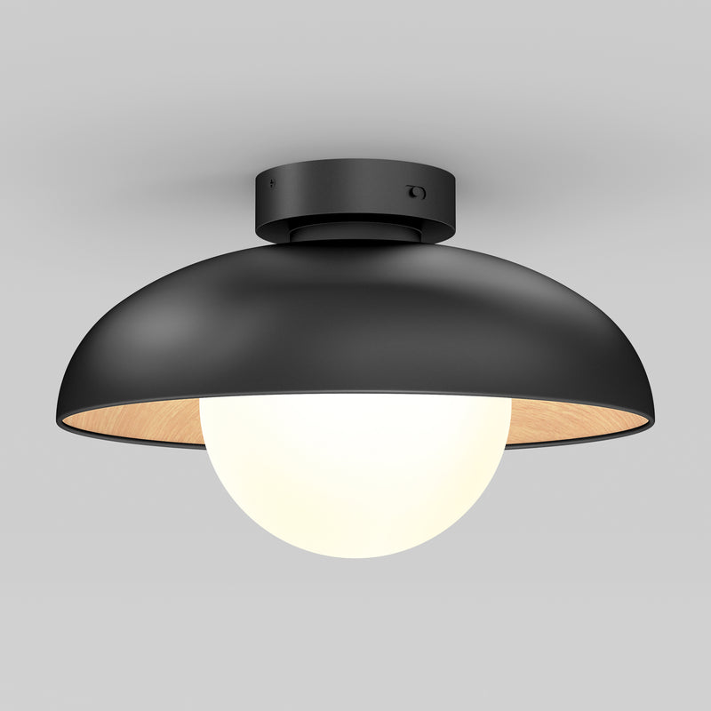 The Artika Boden LED flush mount light features a matte black dome-shaped shade and a white globe bulb, mounted on a gray ceiling.