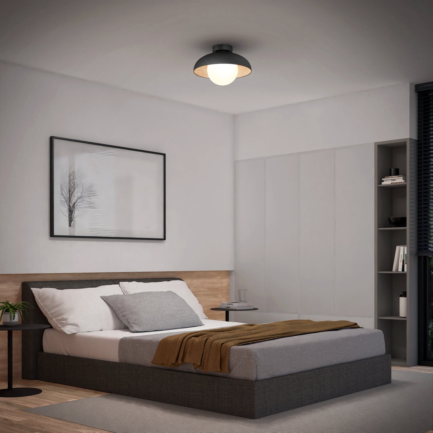 Modern minimalist bedroom with a grey bed, white and grey bedding, brown throw, bedside tables, abstract art, built-in shelves, and the Artika Boden LED flush mount light 5 CCT. Natural light streams through a window with dark blinds.