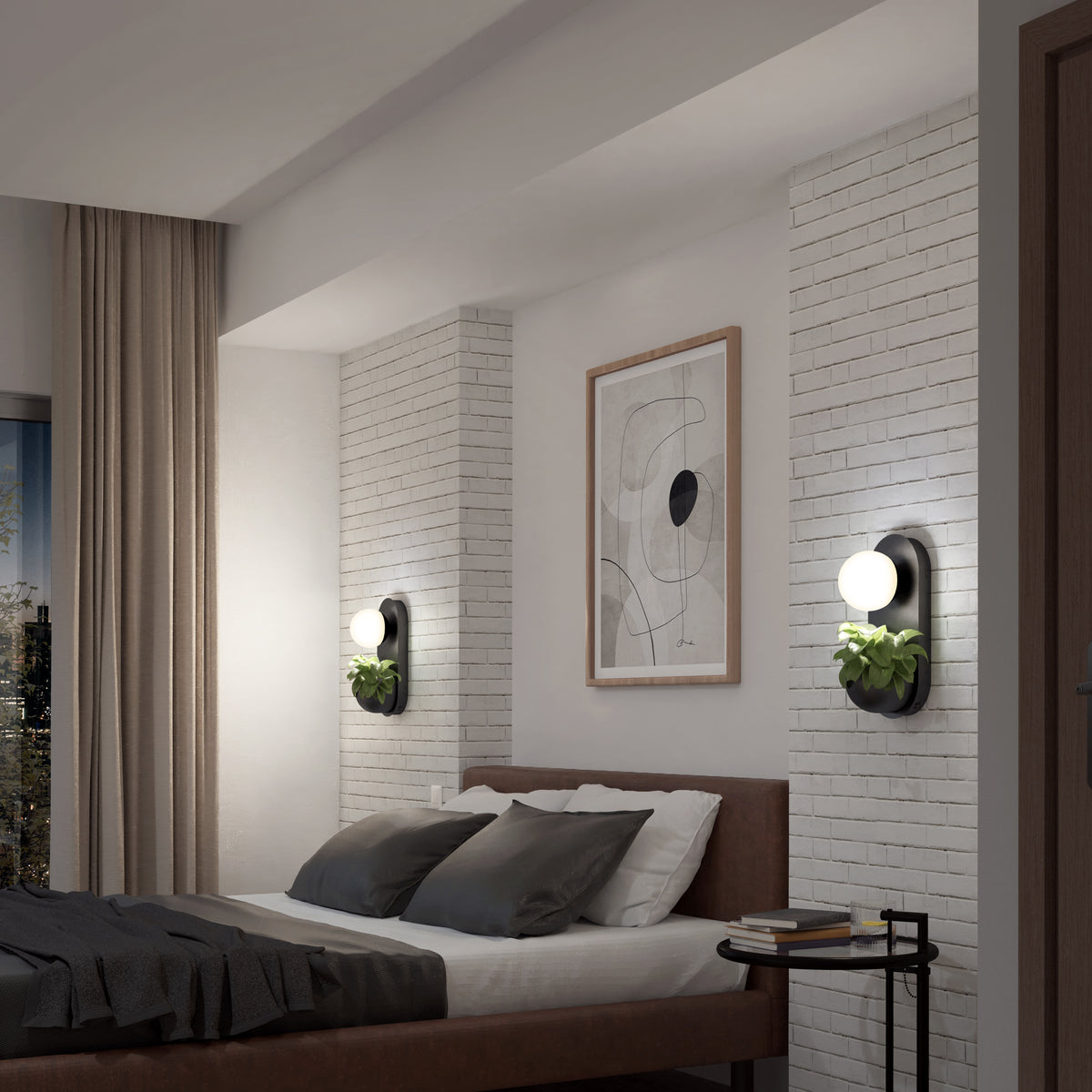 A modern bedroom with a brown bed, gray and white bedding, light brick walls, abstract art above the headboard, and two wall sconces with round bulbs and small potted plants. A side table is next to the bed.