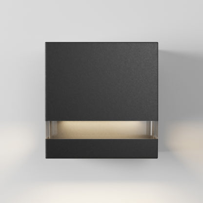 Artika’s Valor Square LED wall light glows from bottom and sides, energy-efficiently illuminating a white wall indoors or outdoors.