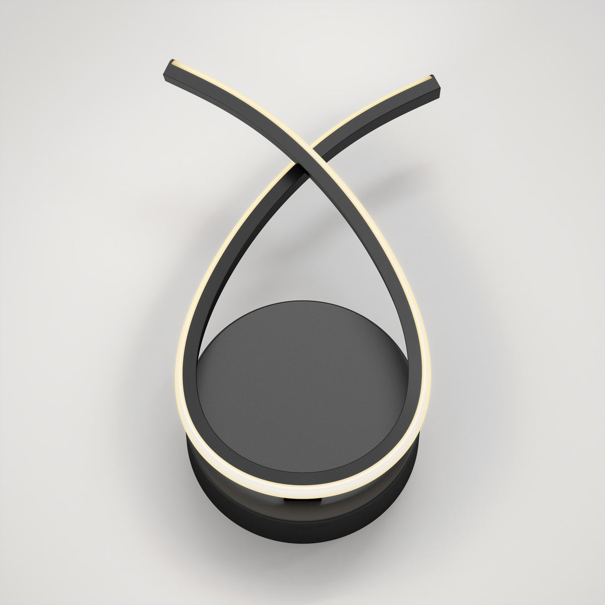 A modern, minimalist LED desk lamp with two black curved arms crossing at the top, each lined with a glowing light strip, mounted on a round black base against a plain white background.