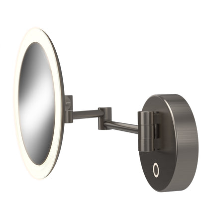 The Artika Radia Cordless LED Cosmetic Mirror, shown wall-mounted with an adjustable arm and brushed metal finish, features a magnifying mirror with an LED light ring against a white background.
