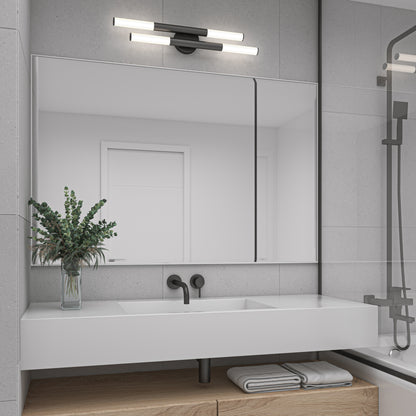 A modern bathroom featuring the Artika Boro LED modern bathroom vanity light, a large rectangular mirror, double sink with black fixtures, green foliage in a vase, and neatly folded towels on a wooden shelf below the white countertop.