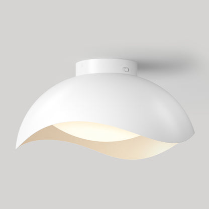 Artika Adara 15 in. (38 cm) Modern LED Flush Mount Ceiling Light 5 CCT with a white, curved, wave-like shade.