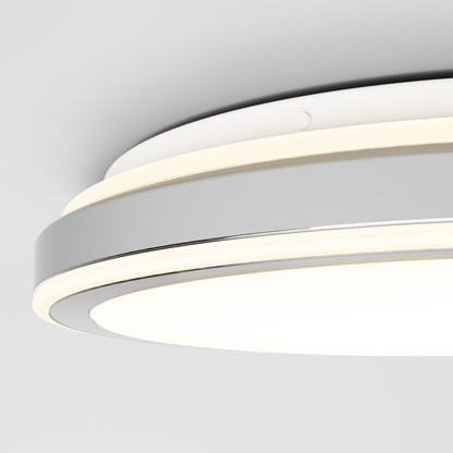 Close-up of the Artika Altitude 15 in. LED modern flush mount light with a sleek white and metallic gray design, 5 CCT settings, and a glowing LED ring, mounted on a white ceiling.