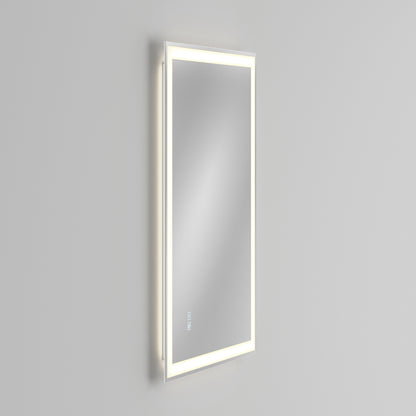 The Artika Sofia LED mirror 3 CCT with defogger features a sleek, modern rectangular design with an illuminated LED border and touch controls, shown wall-mounted at an angle against a plain light gray background.