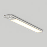 A slim, rectangular LED ceiling light with a silver frame and illuminated white panel, mounted on a plain light gray ceiling. Control buttons and features are visible on one end of the fixture.