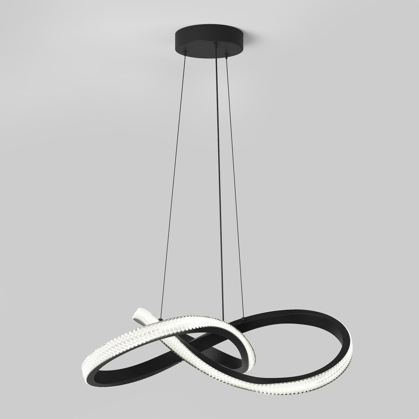 The Artika Morgan LED contemporary pendant light features three black cables suspending a sculptural fixture with intertwined black and white illuminated curves, set against a plain light gray background.