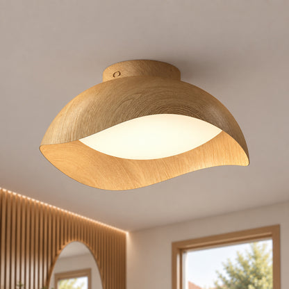 Adara 15 in. (38 cm) Modern LED Flush Mount Ceiling Light 5 CCT with a curved, light-toned wood shade and a frosted circular diffuser.