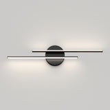 A modern wall light fixture with two horizontal, parallel light bars mounted on a round black base, emitting soft white light against a plain gray wall.