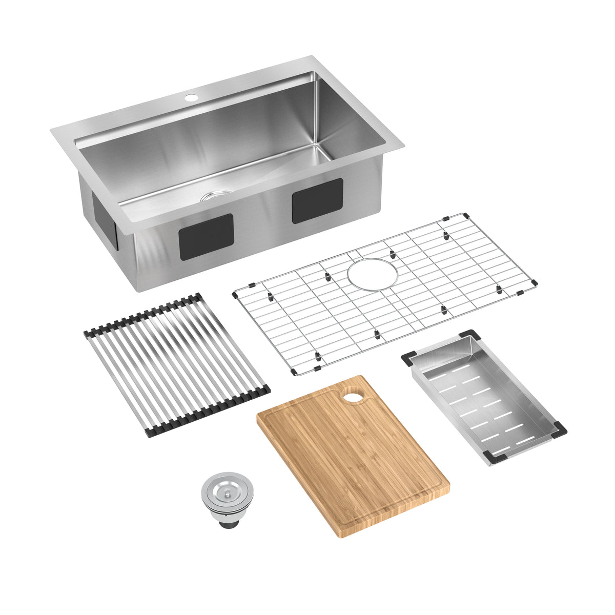 A stainless steel kitchen sink with various accessories: a wire rack, roll-up drying rack, wooden cutting board, metal tray, drain strainer, and a rectangular basin, all arranged on a white background.