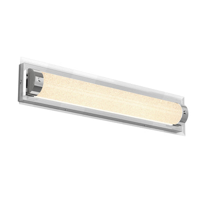 The Artika Glamour LED bathroom vanity light 3 CCT features a modern rectangular design with a frosted, textured cylindrical center, chrome end caps, and a clear rectangular backplate.