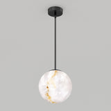A pendant light featuring a round, marble-patterned white glass shade suspended from a black rod and ceiling mount against a plain light gray background.