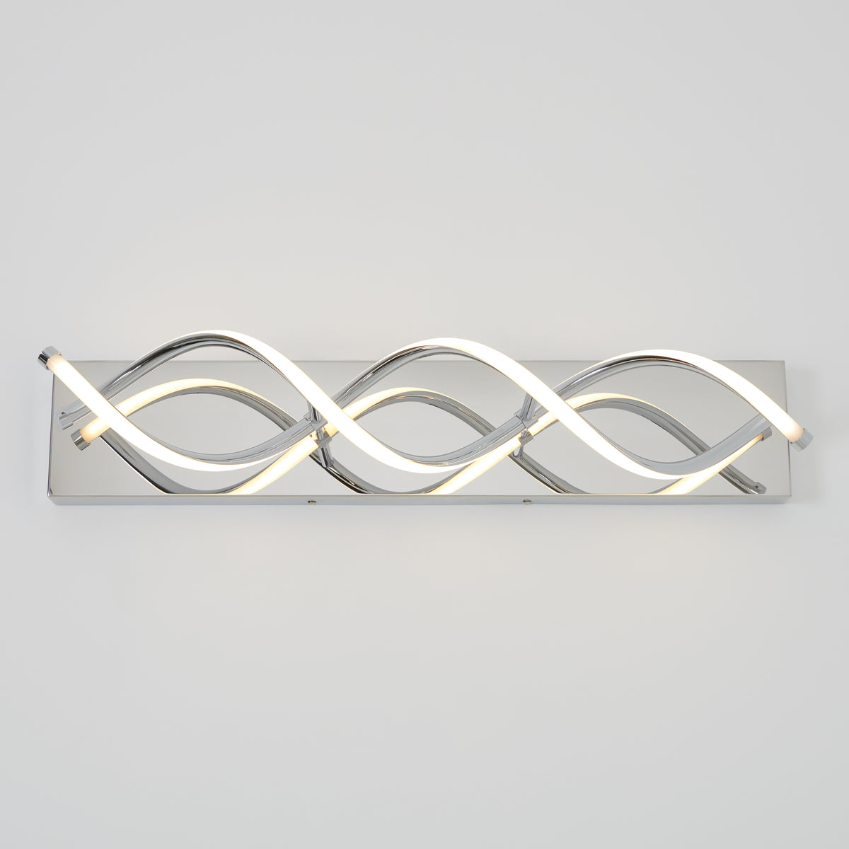 Modern wall light fixture with wave-shaped LED tubes on a rectangular chrome base, mounted horizontally against a plain white wall.