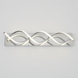 Modern wall light fixture with wave-shaped LED tubes on a rectangular chrome base, mounted horizontally against a plain white wall.